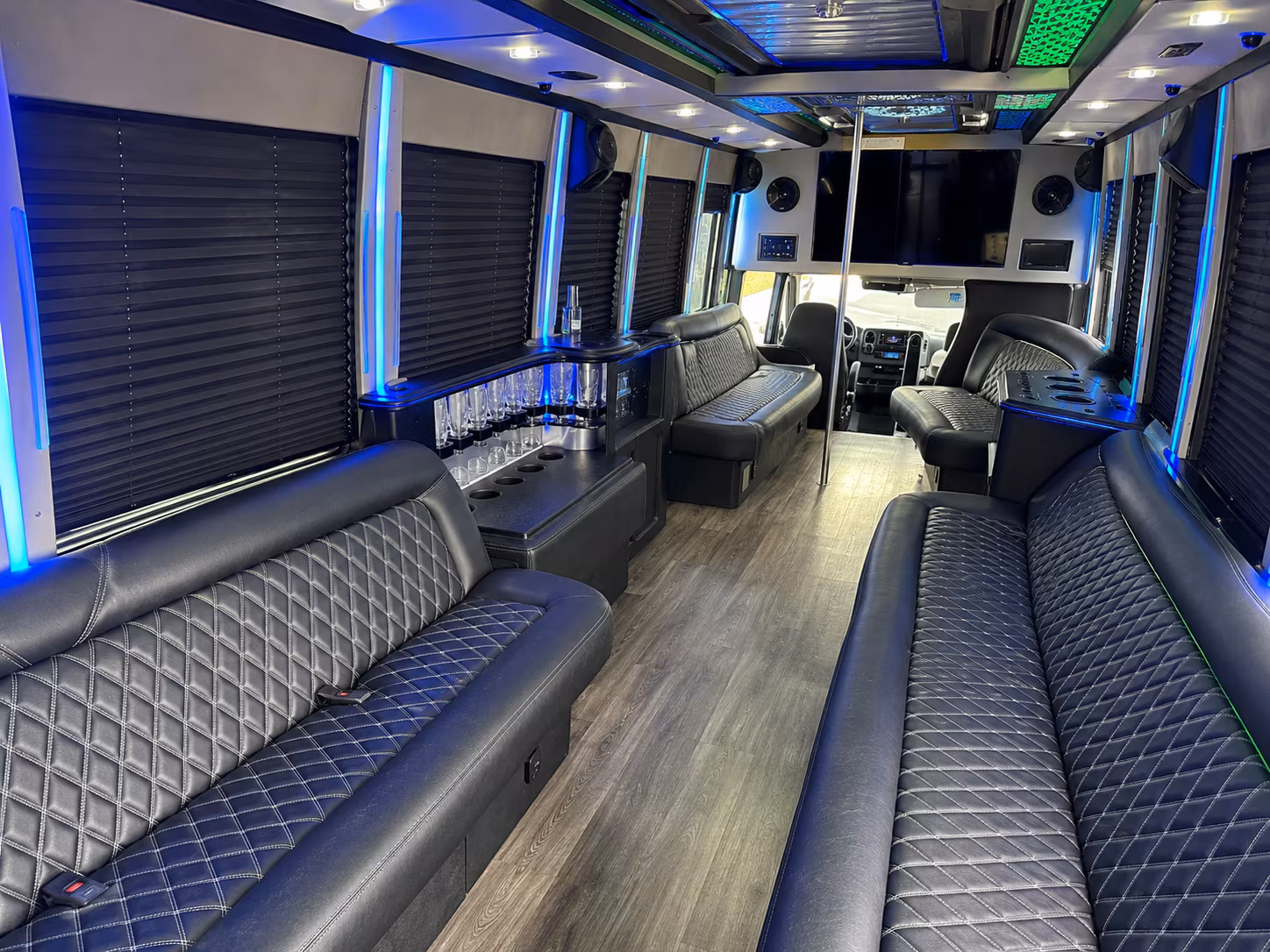 Friends laughing during a party bus celebration in Oceanside